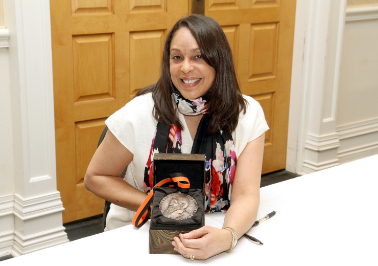 2018 winner Natasha Trethaway holds the Sidney Lanier Prize medal.